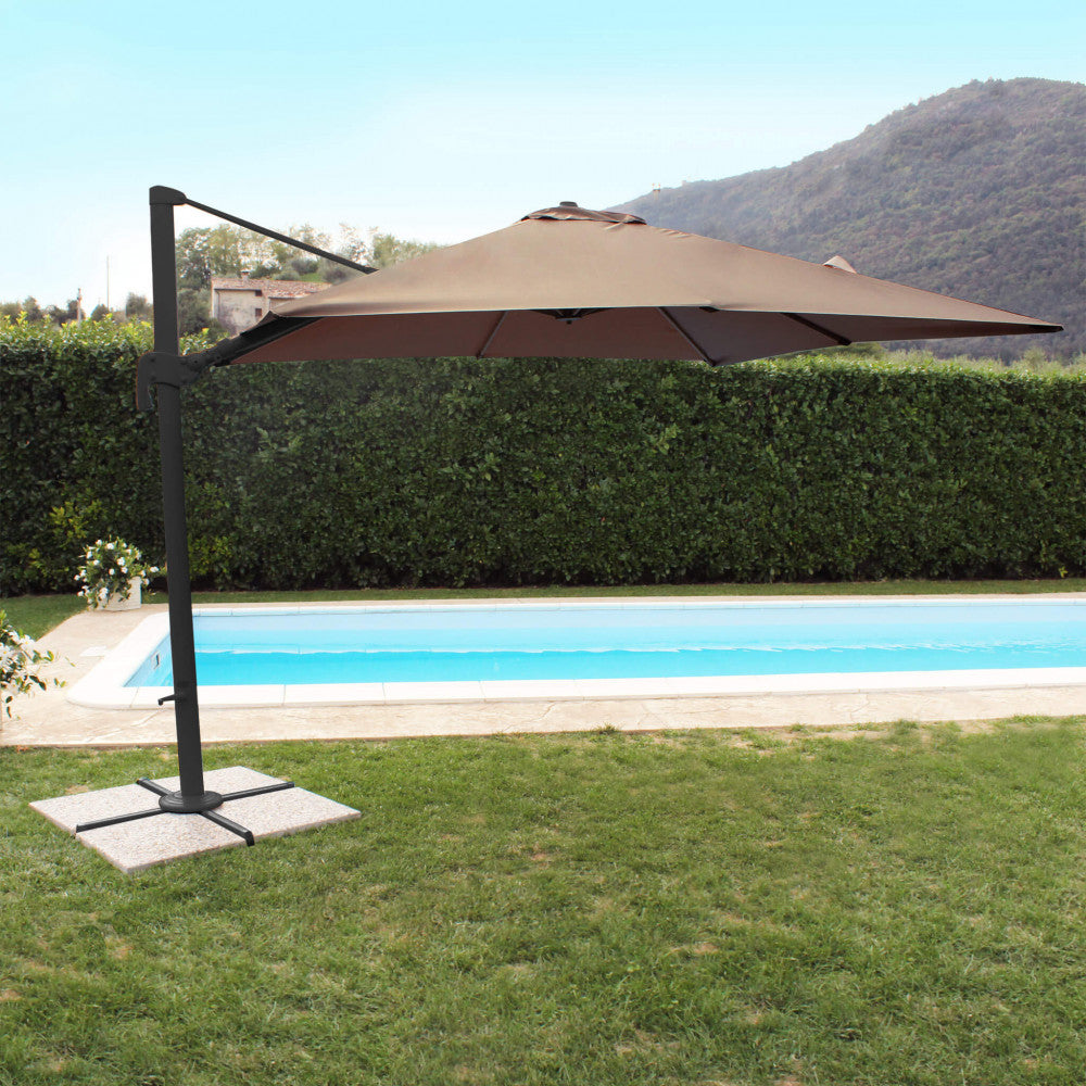 OMBRELLONE NETTUNO LUX NERO P/L 3 X 4 TELO TAUPE. Telo in poliestere TAUPE 250 gr con antivento palo girevole in alluminio 95x65 e 48x55 mm 8 stecche alluminio 17 x 25 mm, base a crociera Dimensioni: m 3 x 4. Arredo Giardino