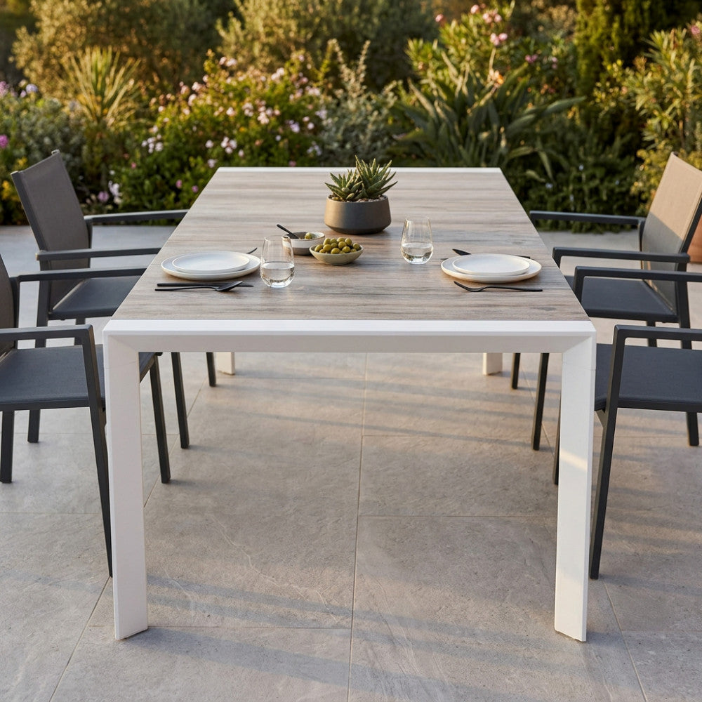 PORTLAND TABLE 175/235 X 100. Structure in ANTHRACITE, TAUPE or WHITE aluminium, table top in GREY wood-effect ceramic in NATURAL taupe. Dimensions: 175/235 x 100 x 75 h cm. Garden Furniture