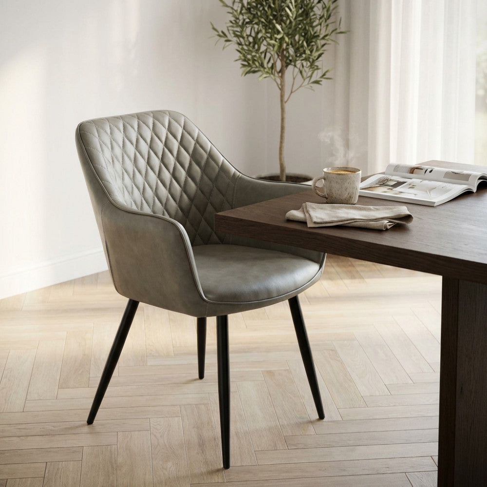 SINDY CHAIR IN FAUX LEATHER. Metal frame, faux leather seat and back. Dimensions: 56 x 60 x 87 cm h.